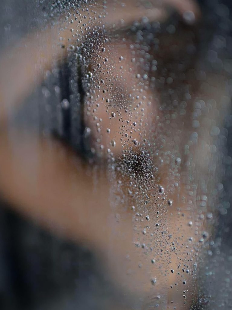 boudoir in altoona pennsylvania, zxr photography, gary tritle
A softly blurred figure behind a foggy, water-streaked glass surface.